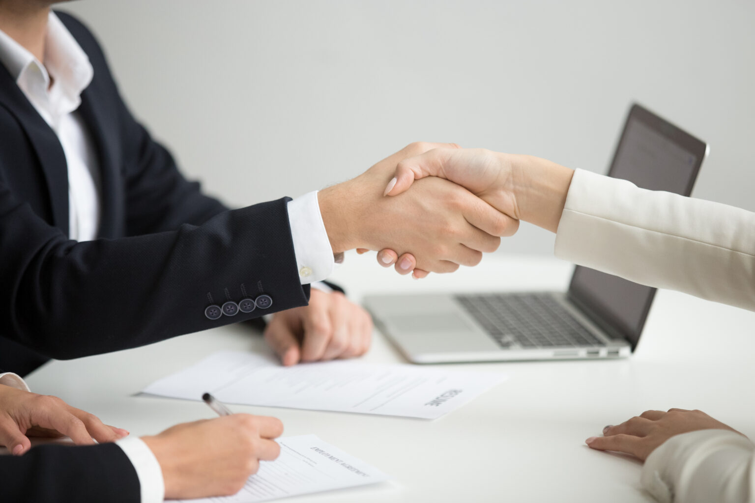 hr-handshaking-successful-candidate-getting-hired-new-job-closeup-1536×1024-1.jpg